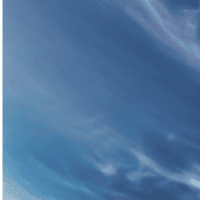 a blue sky with streaky clouds